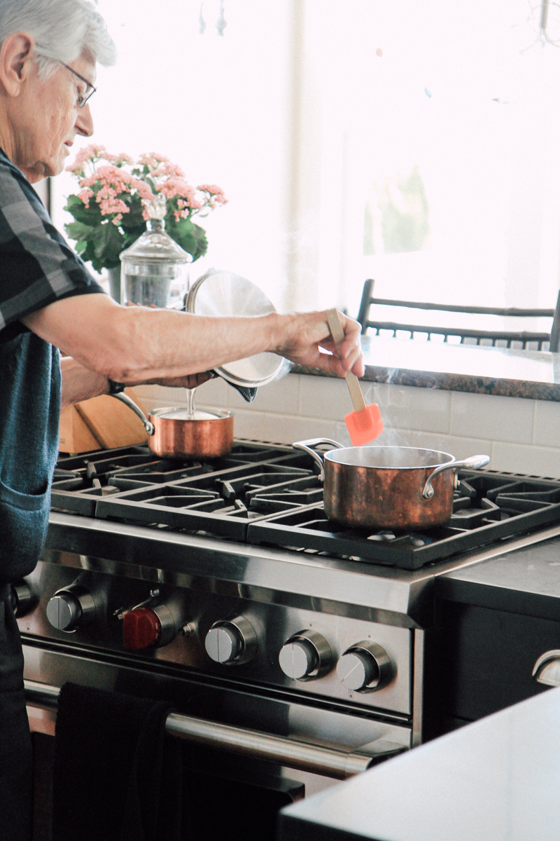 Older adult cooking at a stove